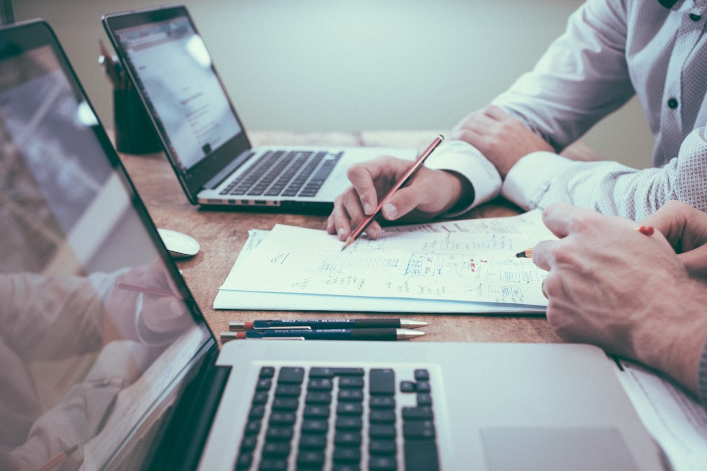 Business advisor reviewing startup documents and compliance paperwork